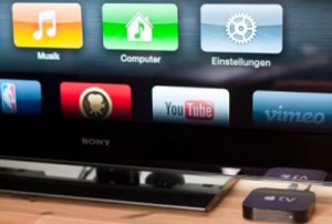 Apple TV in front of an LCD TV