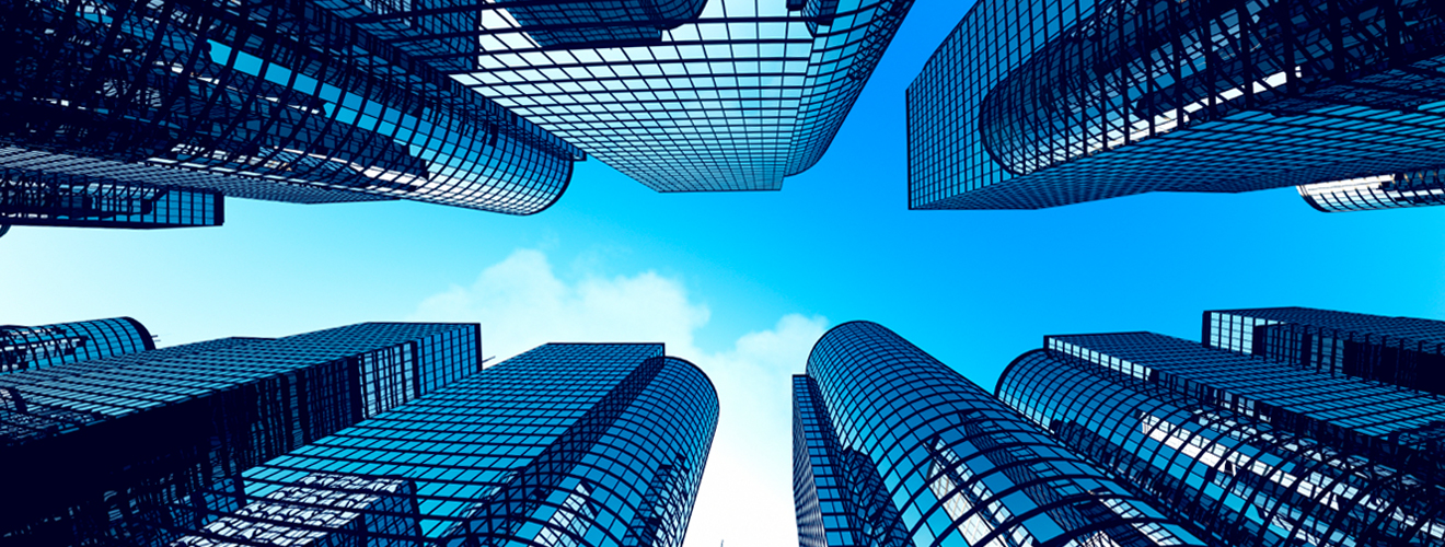 Picture looking up at buildings from the ground.